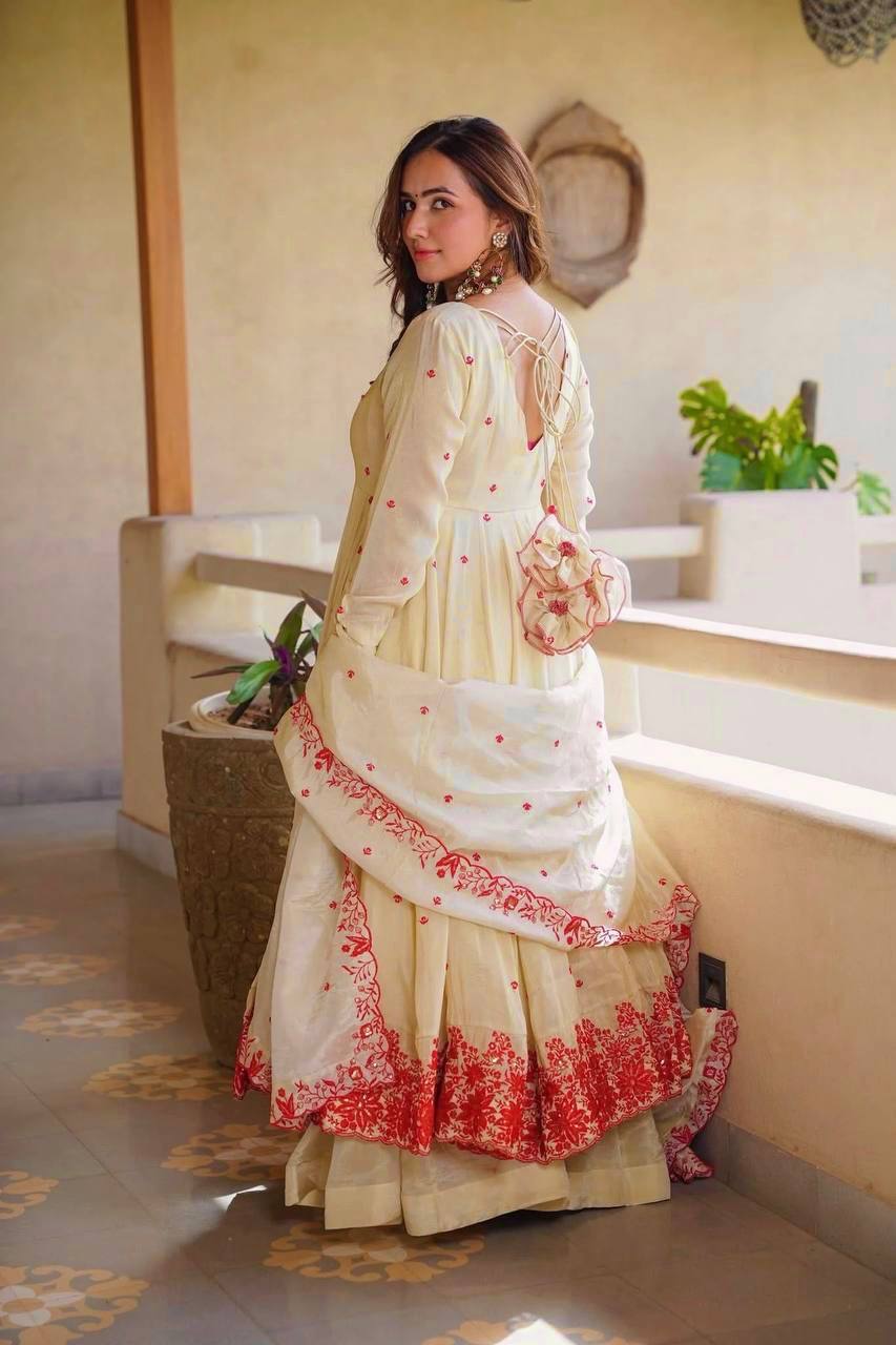 Exquisite Beige Flared Anarkali Suit Set Adorned with Vibrant Red Floral Embroidery, Sequined Scalloped Hem, and an Elegant Tie-Up Back